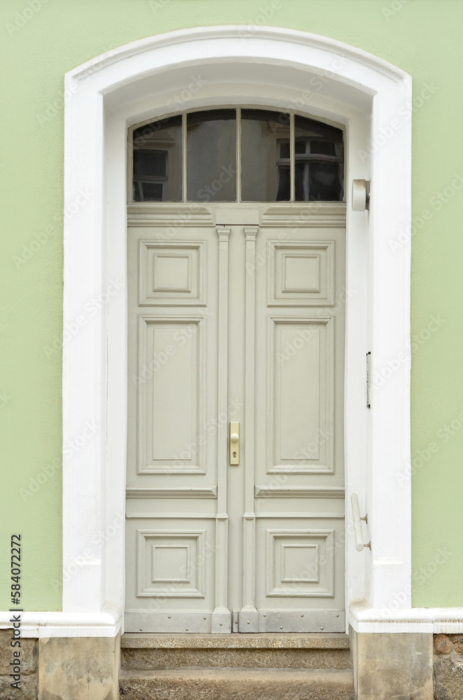 View of city building with wooden door View of city building with wooden door