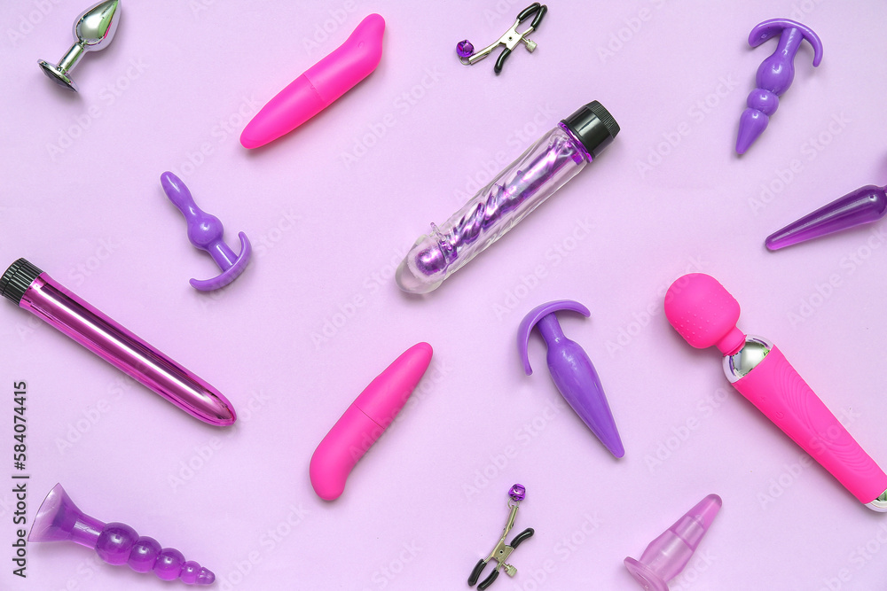 Different sex toys on lilac background Different sex toys on lilac background