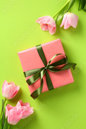 Happy Mother Day concept. Vertical banner design with tulips and gift box. Flat lay, top view. © photoguns