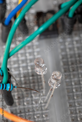 A macro view of a solderless electronics breadboard with wires and some components photo