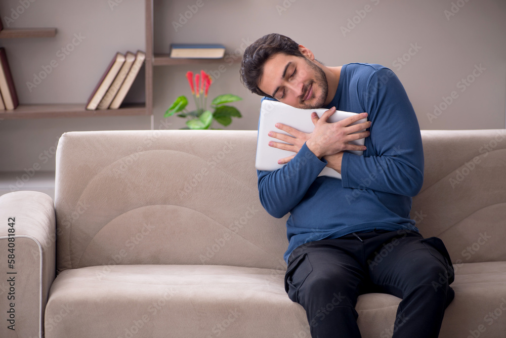 Young male freelancer working from home during pandemic Young male freelancer working from home during pandemic