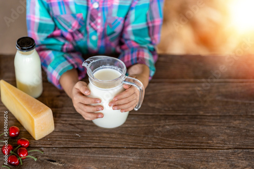 Asian girl hand drinking Fresh milk from modern farm produce and dairy products, top view. , product concepts from dairy farms and health