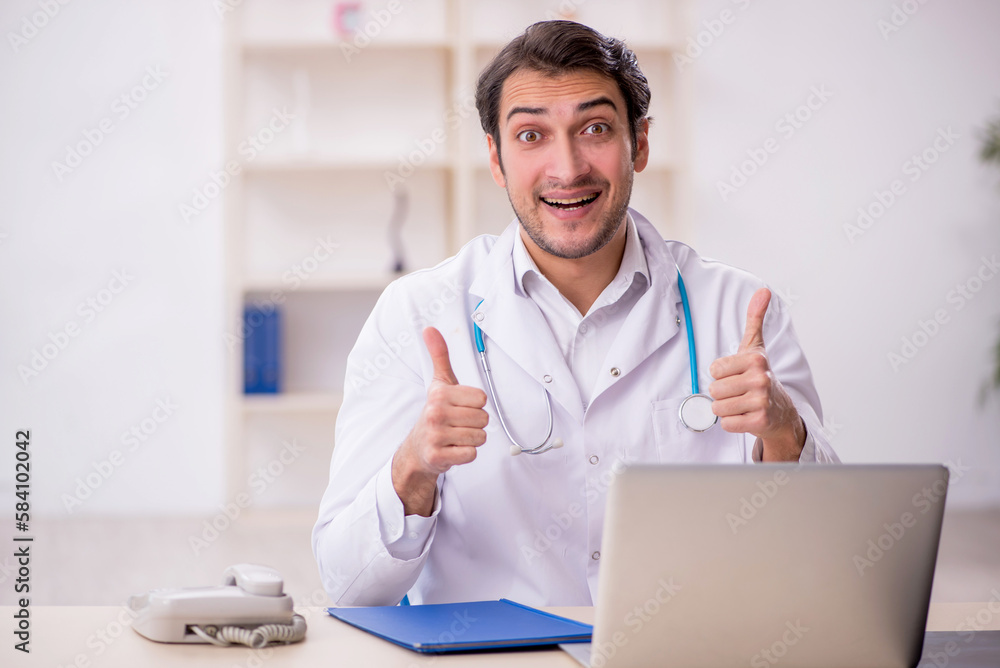 Young male doctor working in the clinic