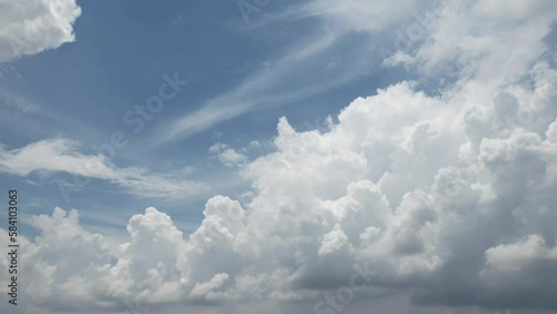 Blue sky white clouds with blue sky in sunny hot summer weather, natural fast motion big mass moving in horizon. photo