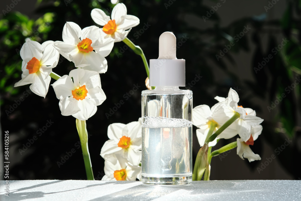 A bottle of serum with a dropper. A bottle of serum with a dropper.