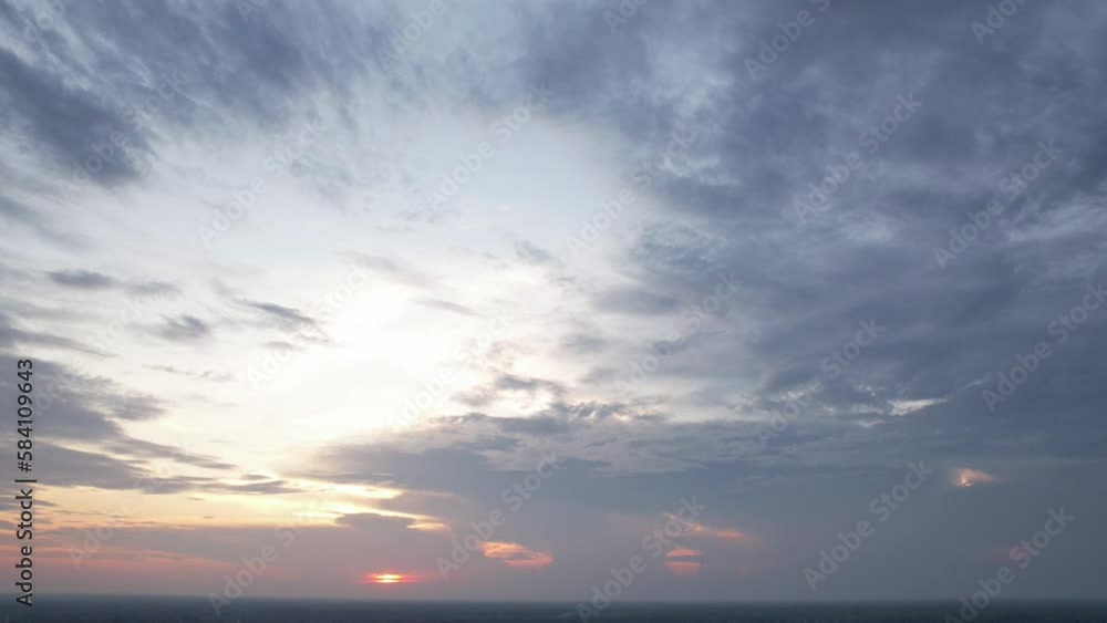 Time lapse clouds at sunrise over the city, Dramatic shining yellow in the sky orange purple cloud sunrise sky. Time lapse clouds at sunrise over the city, Dramatic shining yellow in the sky orange purple cloud sunrise sky.