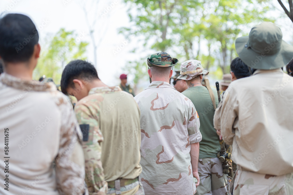 Team of U.S. Army marine corps soldier military war with gun weapon participating and preparing to attack the enemy in Thailand during exercise Cobra Gold training in battle. Combat force.