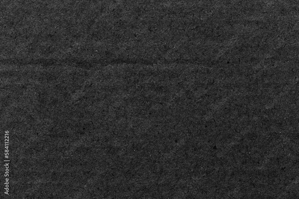 Black paper sheet texture cardboard background. Black paper sheet texture cardboard background.