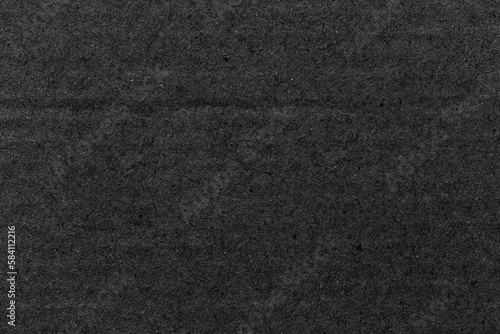 Black paper sheet texture cardboard background. © Southtownboy Studio