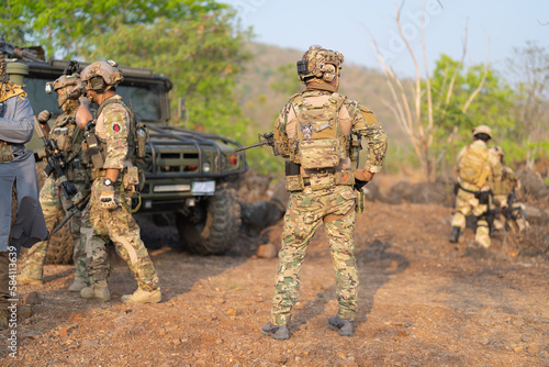 Team of U.S. Army marine corps soldier military war with gun weapon participating and preparing to attack the enemy in Thailand during exercise Cobra Gold training in battle. Combat force.