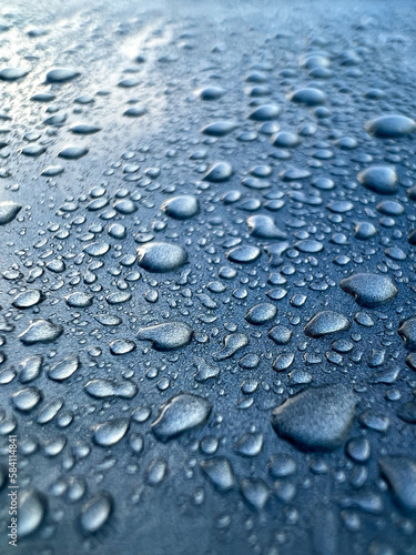 close up drops of water on a car