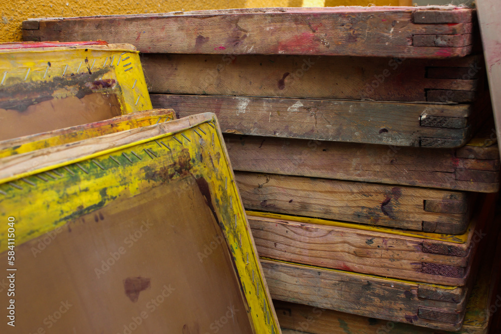 Wooden used screen printing frames stacked Wooden used screen printing frames stacked