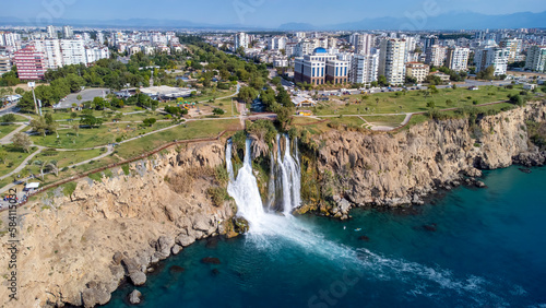 Waterfall Duden (Karpuzkaldiran selalesi) falling into the Mediterranean sea. Waterfall falling into sea. Waterfall stream. Aerial drone shooting. Antalya - Turkey