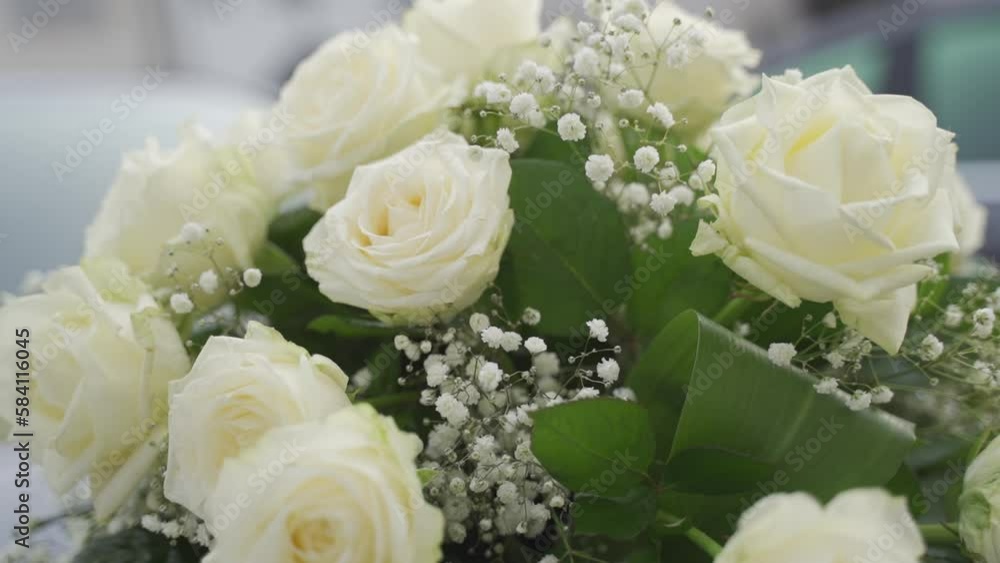 closeup of a bouquet of roses with large white flowers and decorative elements for the wedding closeup of a bouquet of roses with large white flowers and decorative elements for the wedding