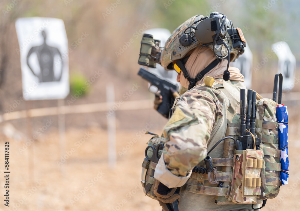 Fototapeta premium Team of U.S. Army marine corps soldier military war with gun weapon participating and preparing to attack the enemy in Thailand during exercise Cobra Gold training in battle. Combat force.