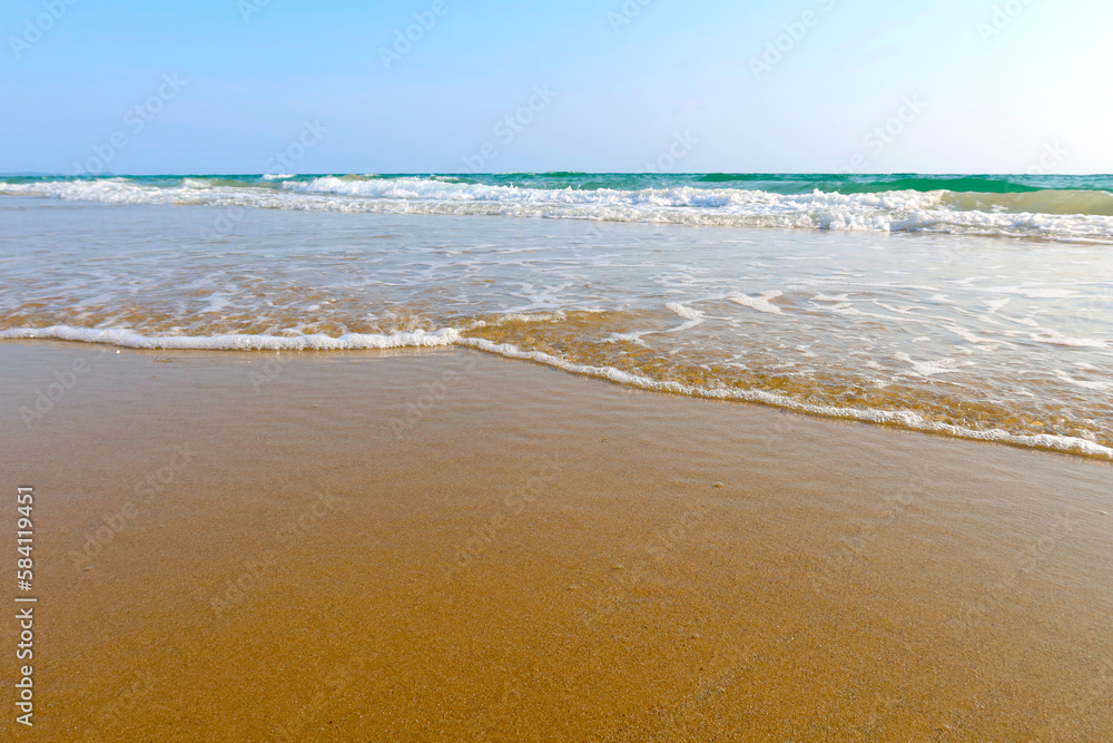 Beach with wave and blue sea water background