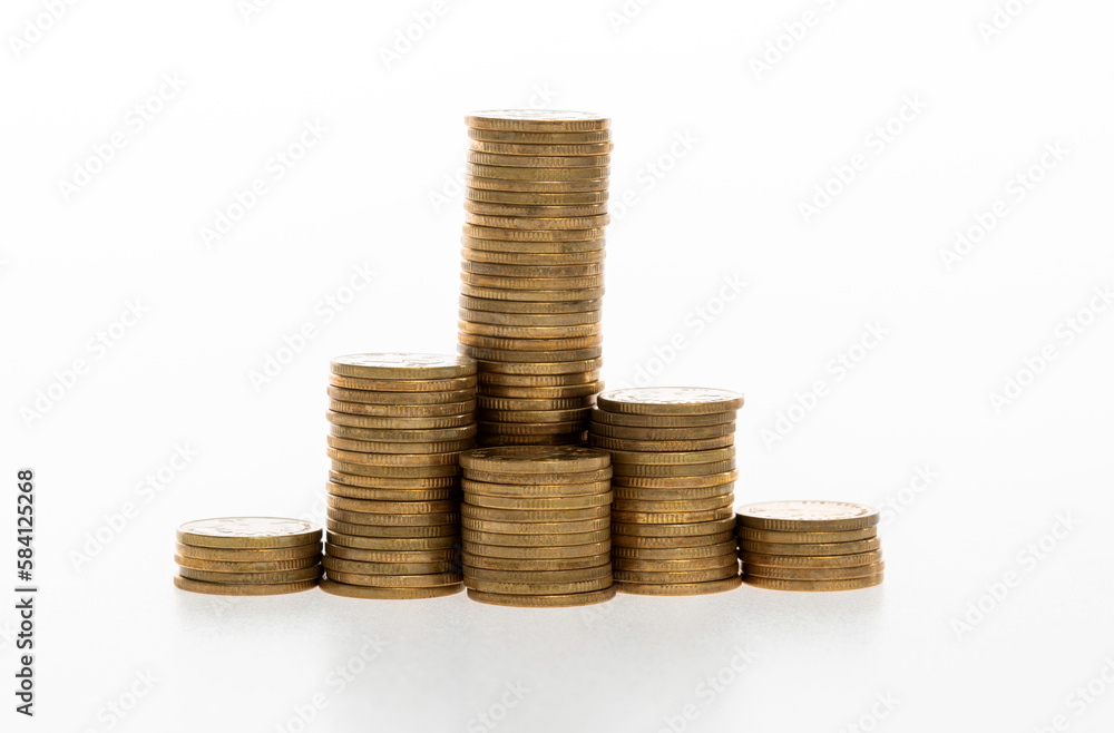 Golden coins stacked on white background Golden coins stacked on white background