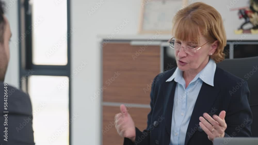 Woman HR specialist manager talking to Indian male job candidate job interview at office meeting. Recruitment concept Woman HR specialist manager talking to Indian male job candidate job interview at office meeting. Recruitment concept