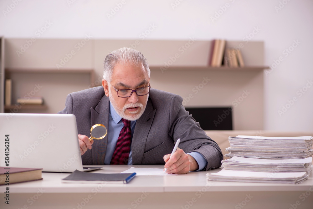 Old male employee working from home during pandemic Old male employee working from home during pandemic