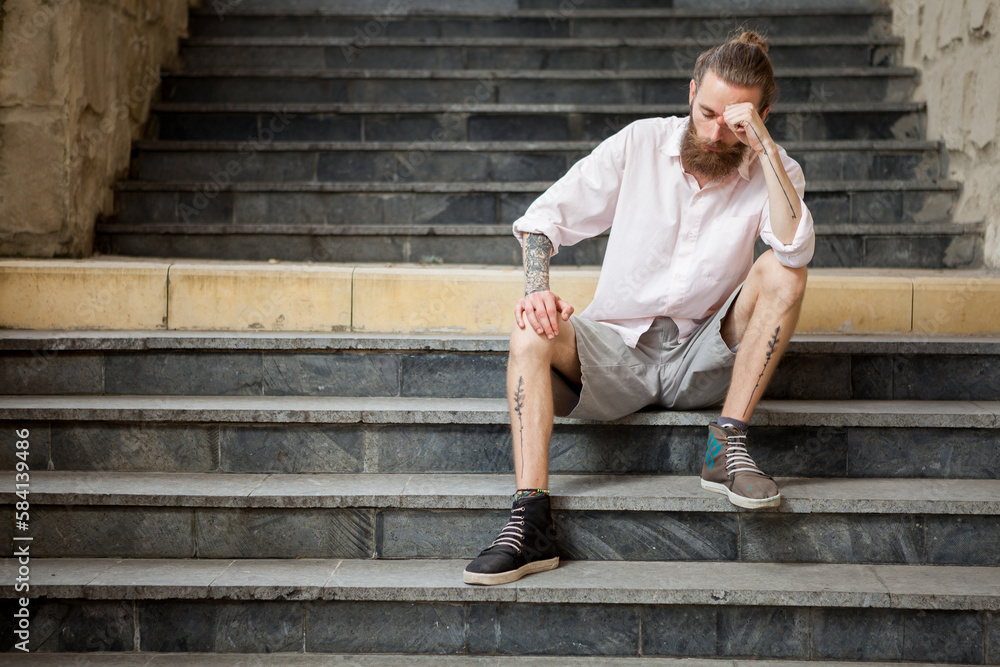 Bearded guy posing outdoor in the city Bearded guy posing outdoor in the city