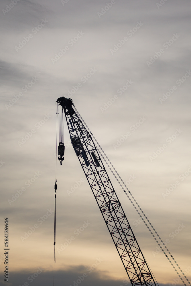 high-rise building crane on the background of the evening sky, building high-rise building crane on the background of the evening sky, building