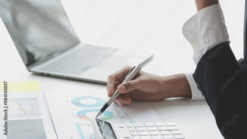 Financial analysts analyze business financial reports on a digital tablet planning investment project during a discussion at a meeting of corporate showing the results of their successful teamwork. Financial analysts analyze business financial reports on a digital tablet planning investment project during a discussion at a meeting of corporate showing the results of their successful teamwork.