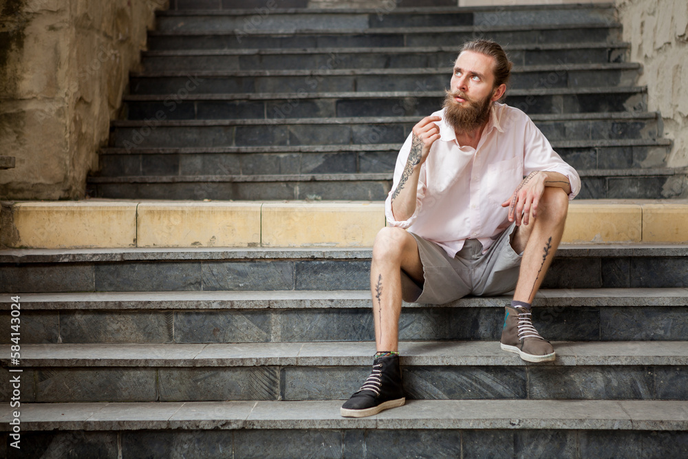 Bearded guy posing outdoor in the city Bearded guy posing outdoor in the city