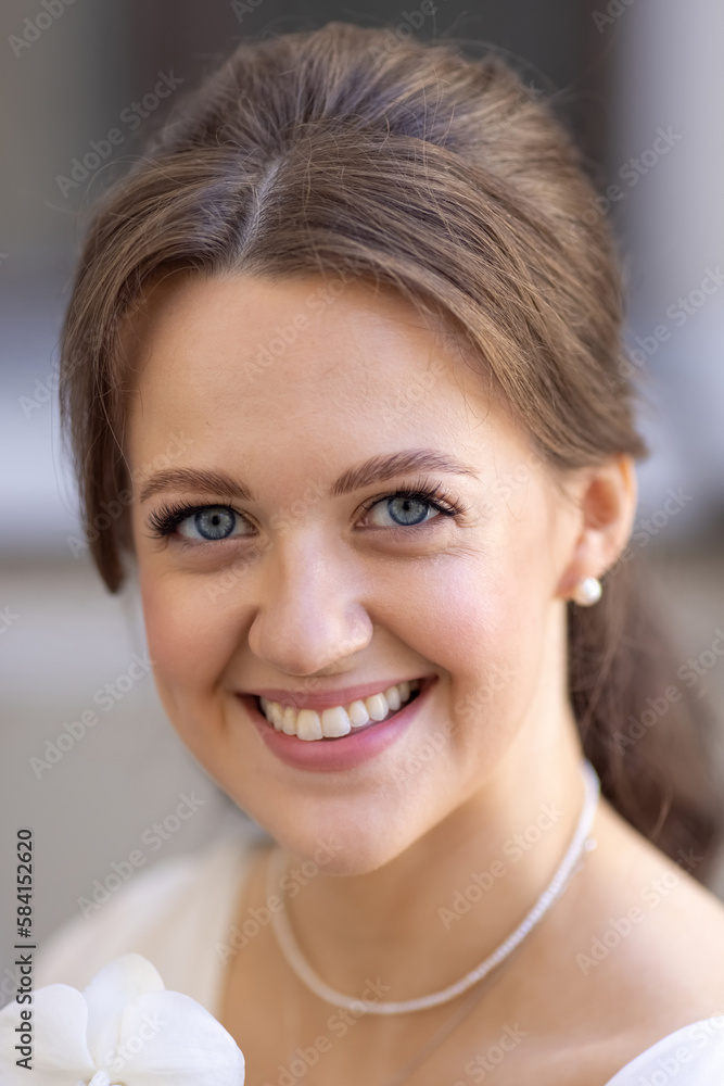 Bride holding white orchid flower Bride holding white orchid flower