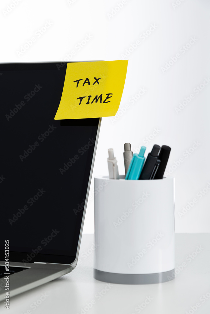 Tax time text on the laptop Tax time text on the laptop