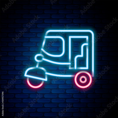 Glowing neon line Taxi tuk tuk icon isolated on brick wall background. Indian auto rickshaw concept. Delhi auto. Colorful outline concept. Vector