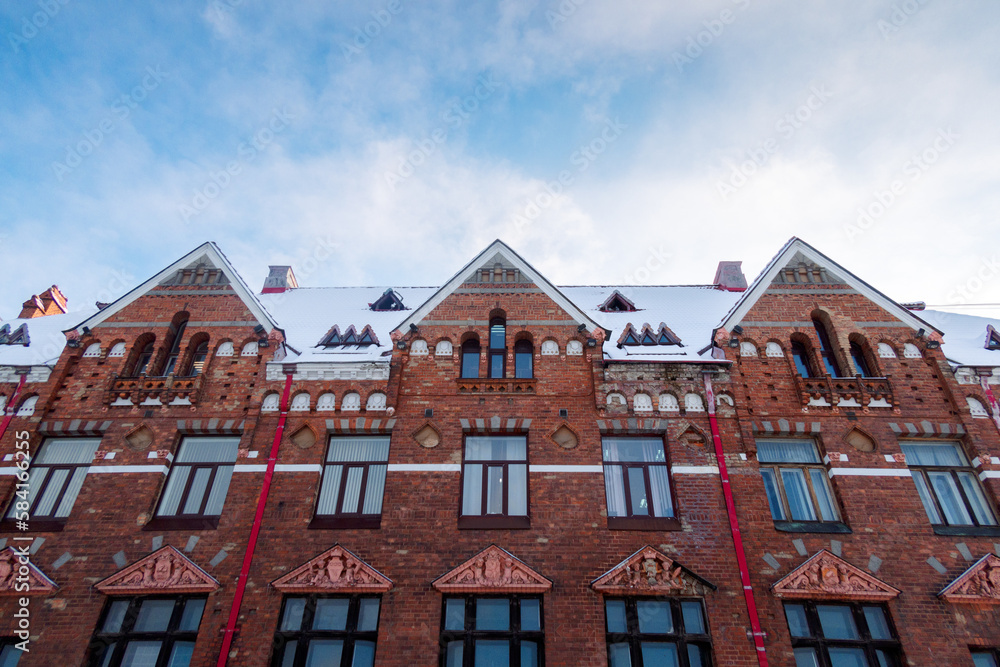 Facade view of red brick Bank of Finland building at Market Square, Vyborg, Russia. High quality photo