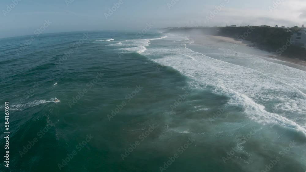 Aerial dolly over salty ocean spray coming off top of crashing waves Aerial dolly over salty ocean spray coming off top of crashing waves