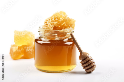 jar of honey and honeycomb. white background. 