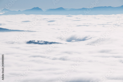 Morning clouds rolling over the scenery and mountains over the Czech Republic creating different formations based on temperature, pressure and airflow. Meteorology © Fauren