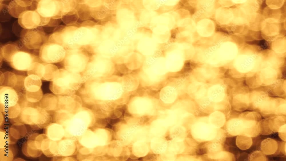 Blurred golden sea at sunset. The sun reflects and sparkles on the waves with bokeh, illuminating the golden sea. Holiday recreation concept. Abstract nautical summer ocean sunset nature background. Blurred golden sea at sunset. The sun reflects and sparkles on the waves with bokeh, illuminating the golden sea. Holiday recreation concept. Abstract nautical summer ocean sunset nature background.