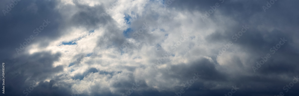 The sky is covered with thick clouds, through which sunlight barely penetrates The sky is covered with thick clouds, through which sunlight barely penetrates