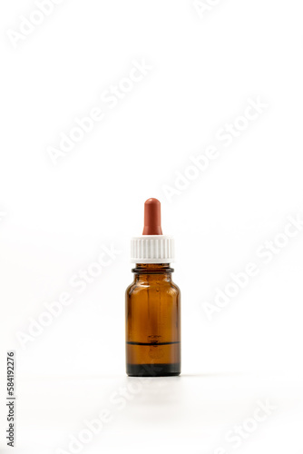 Medical drops in a vial isolated on white background with clipping path