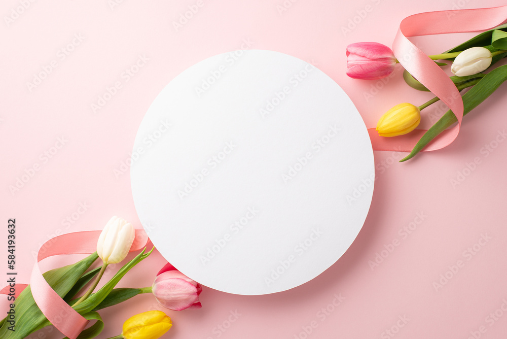 Women's Day concept. Top view photo of white circle bunches of colorful tulips and silk ribbon on isolated pastel pink background with copyspace