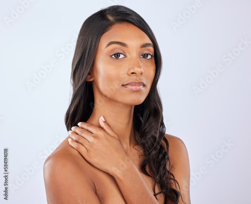 Indian girl, hair or beauty in studio portrait for growth, healthy natural shine or grooming wellness. Face of glowing young woman model, salon spa mockup or self care cosmetics on white background