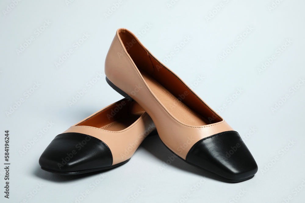 Pair of new stylish square toe ballet flats on light grey background Pair of new stylish square toe ballet flats on light grey background
