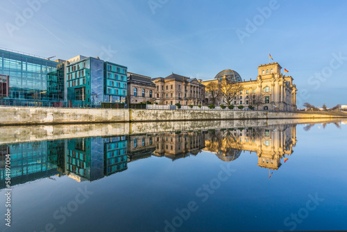 Reichstag with reflection in river Spree photo