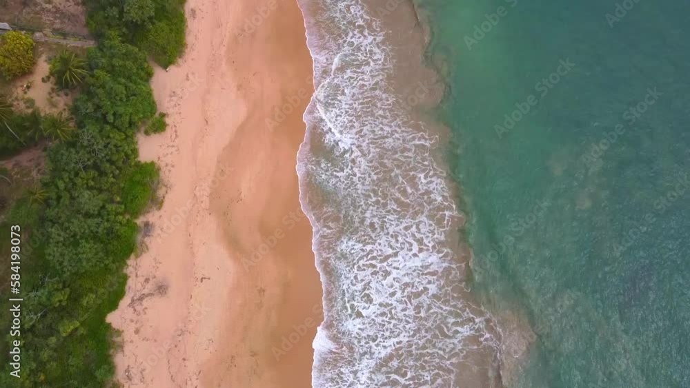 Aerial view from above on a beautiful sandy sea shore. Ocean coast. Calm beautiful video on the background for tourism, design and advertising Aerial view from above on a beautiful sandy sea shore. Ocean coast. Calm beautiful video on the background for tourism, design and advertising