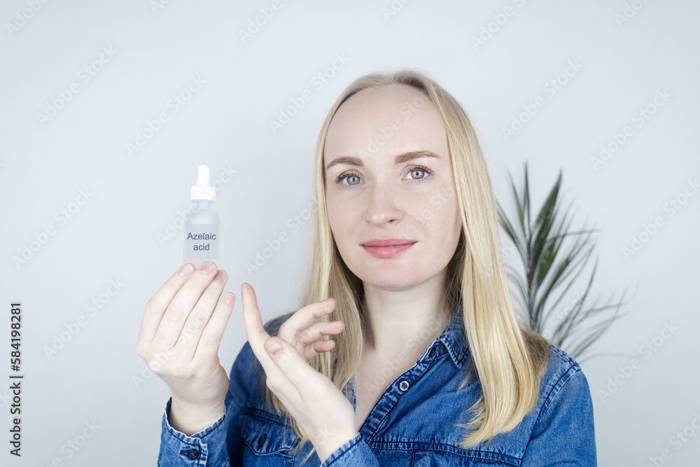 Azelaic acid. The girl applies azelainates to her face. Laboratory research. Facial skin care. Dermatological serum. Emulsion for the treatment of rosacea, acne and skin problems Azelaic acid. The girl applies azelainates to her face. Laboratory research. Facial skin care. Dermatological serum. Emulsion for the treatment of rosacea, acne and skin problems
