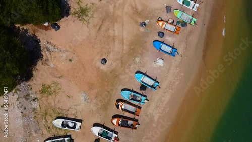 Aerial view of the flight from above over the fishing boats of the south. Calm beautiful video on the background for tourism, design and advertising.