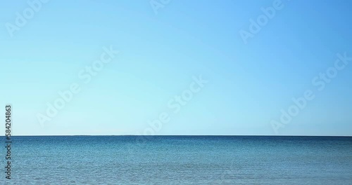 Sea horizon in a beautiful blue sea on a clear blue sky day. photo