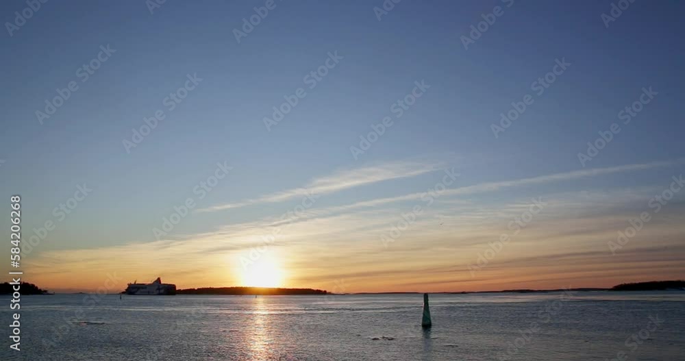 Winter sunset at Hernesaari with cruisimg ship moving, Helsinki, Finland. Winter sunset at Hernesaari with cruisimg ship moving, Helsinki, Finland.