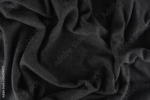 Black fabric background.