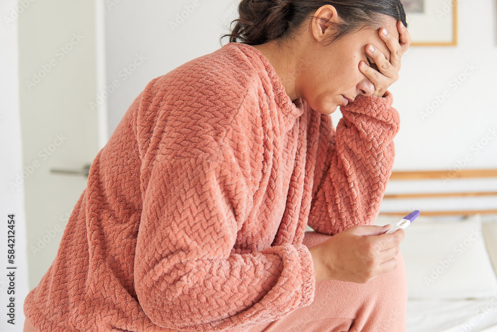 The Struggle Against Infertility: A Sad middle age Woman Contemplates Her Negative Pregnancy Test The Struggle Against Infertility: A Sad middle age Woman Contemplates Her Negative Pregnancy Test