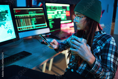 Mobile, cyber security or girl by computer screen in dark room at night for coding, research or blockchain. Coffee, phone hacker or woman hacking online in digital transformation on global website