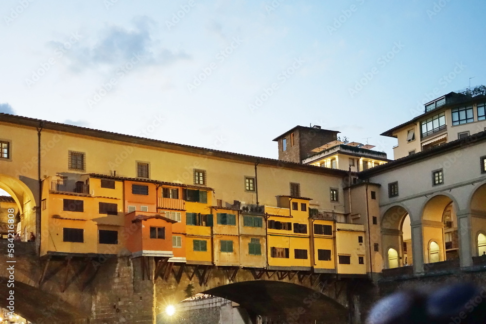 Detail of Ponte Vecchio seen from a boat on the Arno River in Florence, Tuscany, Italy